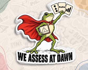 May include: A die-cut sticker featuring a green frog wearing a red cape, holding a clipboard with a bell curve graph and three cards with geometric shapes. The text WE ASSESS AT DAWN is printed in bold black letters at the bottom of the sticker.