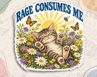May include: A die-cut sticker featuring a tabby kitten lying on its back in a field of daisies and purple wildflowers. Above the kitten is a yellow sun, two orange butterflies, a bee, and the blue text RAGE CONSUMES ME.