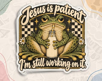 May include: A die-cut sticker featuring a green frog holding a glass bottle of milk with a straw. The text reads Jesus is patient I'm still working on it. The background has a black and white checkered pattern with small yellow stars and white flowers.