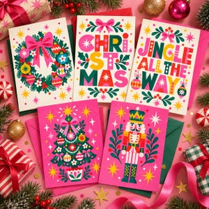 May include: Five holiday greeting cards featuring colorful illustrations of a wreath, the text CHRISTMAS, the text JINGLE ALL THE WAY, a decorated Christmas tree, and a nutcracker, all accented with stars and bows on a pink background.