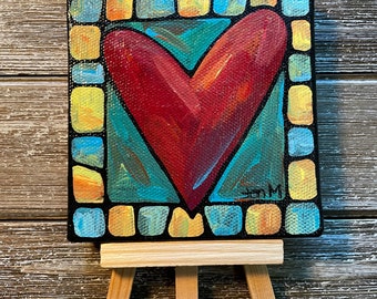 A red Heart mini 4”x4” canvas painting on easel