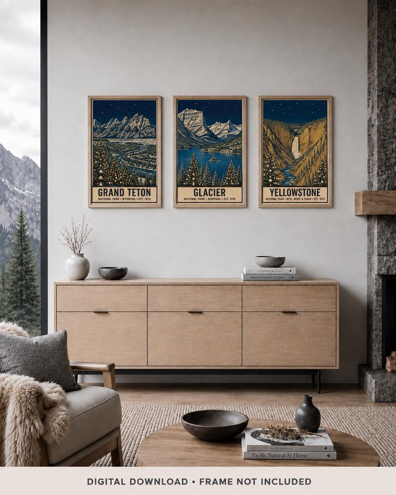 May include: Three vertical framed art prints depicting Grand Teton, Glacier, and Yellowstone National Parks. Each print features a dark blue night sky, snow-capped mountains, evergreen trees, and text identifying the specific national park.