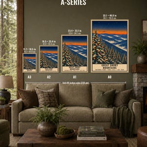 May include: A series of four posters depicting the Great Smoky Mountains National Park at sunset, displayed in A3, A2, A1, and A0 sizes. Each print features snow-covered pine trees with lights against a mountain range and starry sky.