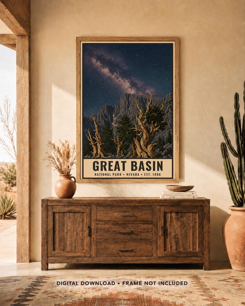 May include: A rectangular wall art print featuring a night sky with a visible Milky Way galaxy above rugged mountain peaks and twisted bristlecone pine trees. The bottom section contains the text GREAT BASIN NATIONAL PARK NEVADA EST. 1986.