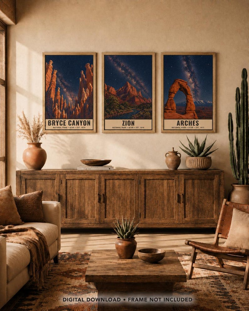 May include: Three vertical wall art prints featuring Bryce Canyon, Zion, and Arches National Parks in Utah. Each print displays a night sky with a starry galaxy above red rock formations and includes the text identifying the park and year.