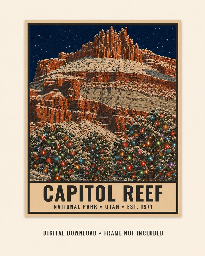 May include: A poster featuring a snow-covered red rock mountain formation under a starry night sky. In the foreground, snow-dusted trees are decorated with colorful string lights. The text reads CAPITOL REEF NATIONAL PARK UTAH EST. 1971.