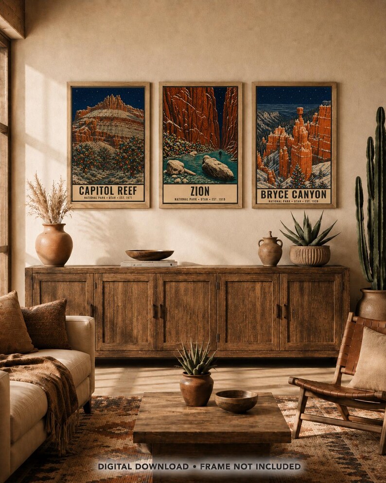 May include: Three vertical art prints featuring illustrations of Capitol Reef, Zion, and Bryce Canyon National Parks in Utah. Each print displays a landscape scene with red rock formations, trees, and starry night skies, with text identifying the park.