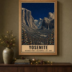 May include: A framed vertical poster depicting a night scene of Yosemite National Park with snow-covered mountains, a starry sky, and evergreen trees decorated with colorful lights. The text reads YOSEMITE NATIONAL PARK CALIFORNIA EST. 1890.