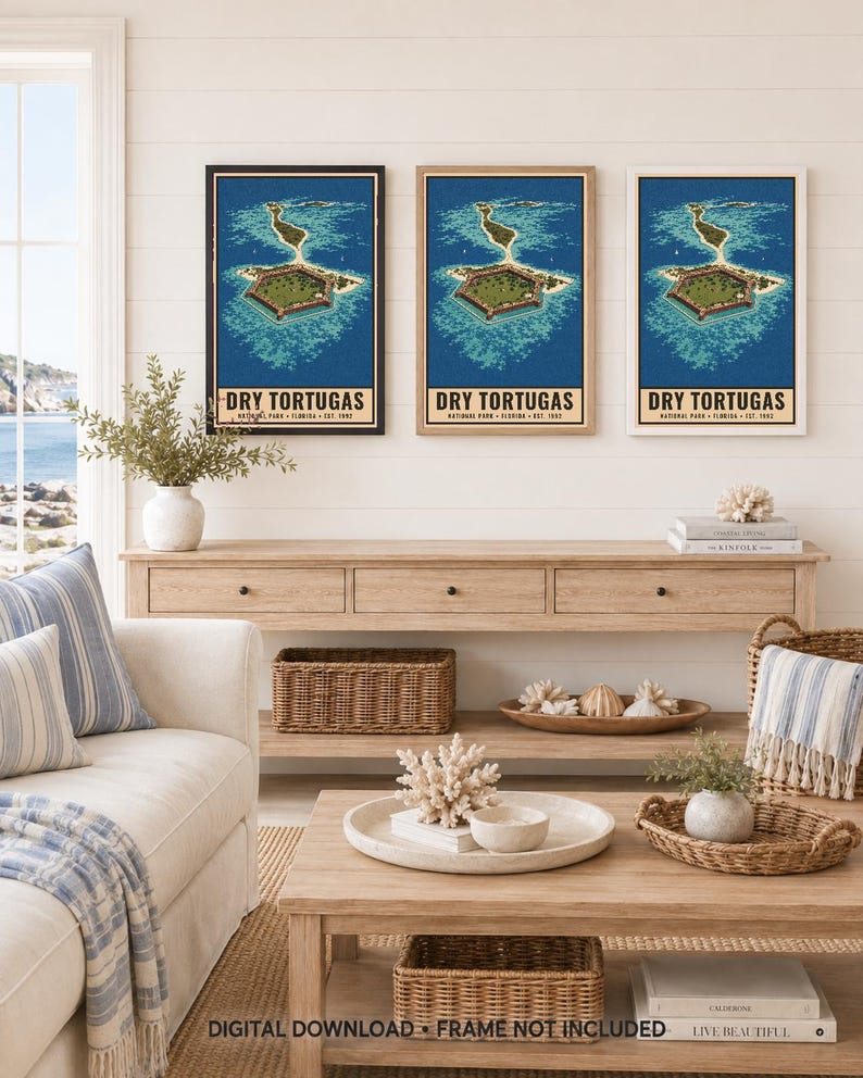 May include: Three framed wall art prints featuring an aerial illustration of Dry Tortugas National Park, Florida, with blue ocean water and a hexagonal fort. Each print includes the text DRY TORTUGAS NATIONAL PARK FLORIDA EST. 1992 at the bottom.