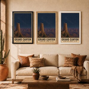 May include: Three vertical wall art prints featuring the Grand Canyon National Park, Arizona, established 1919. Each print displays a stone desert watchtower at night under a starry sky, framed in black, light wood, and white frames respectively.