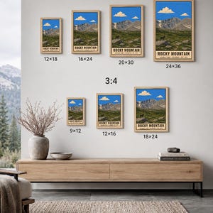 May include: A collection of framed Rocky Mountain National Park posters in various sizes, including 30x46, 41x61, 51x76, 61x91, 23x30, 30x41, and 46x61 cm. The prints feature a mountain landscape with blue sky, clouds, and text reading Rocky Mountain.