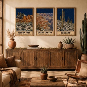 May include: Three framed vertical wall art prints depicting Joshua Tree, Grand Canyon, and Saguaro National Parks at night. Each print features a dark blue starry sky above a desert landscape with text at the bottom. Digital download, frame not included.