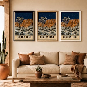 May include: Three identical vertical wall art prints featuring a Joshua Tree National Park landscape at night with orange rock formations, a starry sky, and desert vegetation. Each print includes the text JOSHUA TREE NATIONAL PARK CALIFORNIA EST. 1994.
