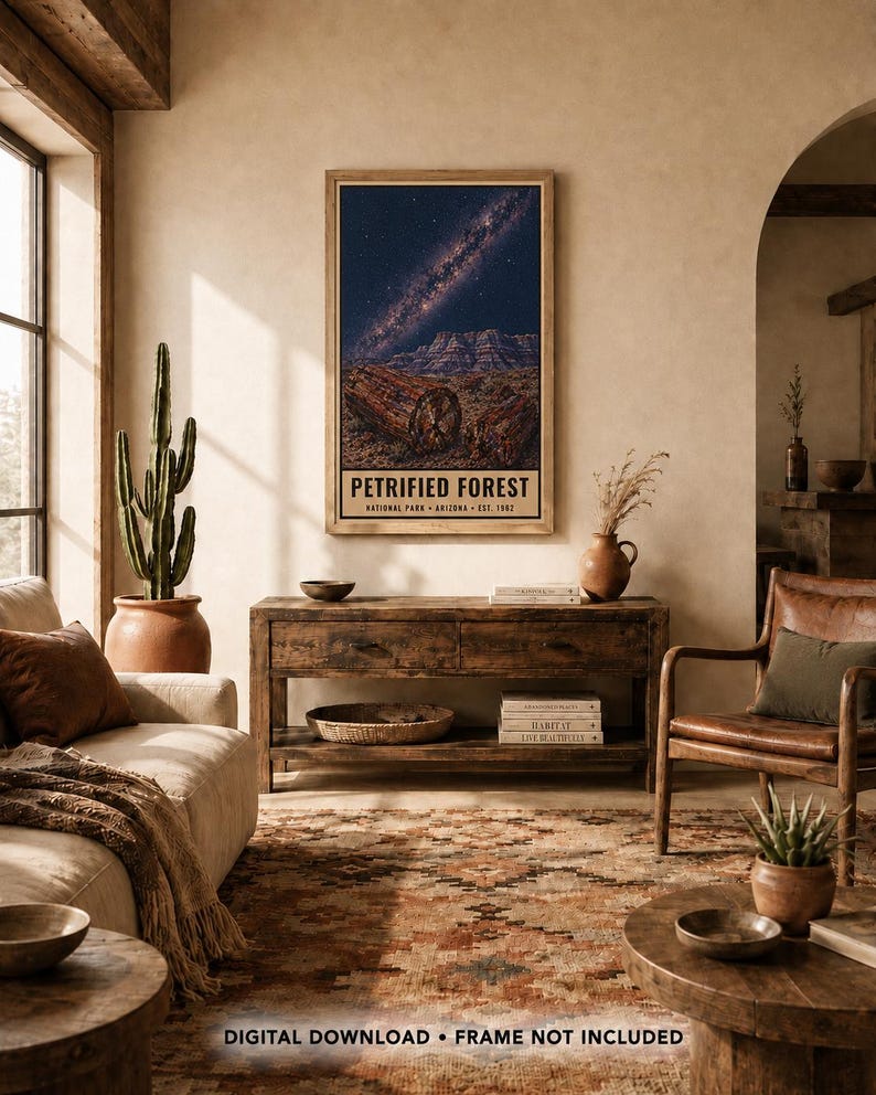 May include: A vertical rectangular wall art print featuring a night sky with a visible Milky Way galaxy above a desert landscape with petrified wood logs. The text PETRIFIED FOREST NATIONAL PARK ARIZONA EST. 1962 is printed at the bottom of the print.