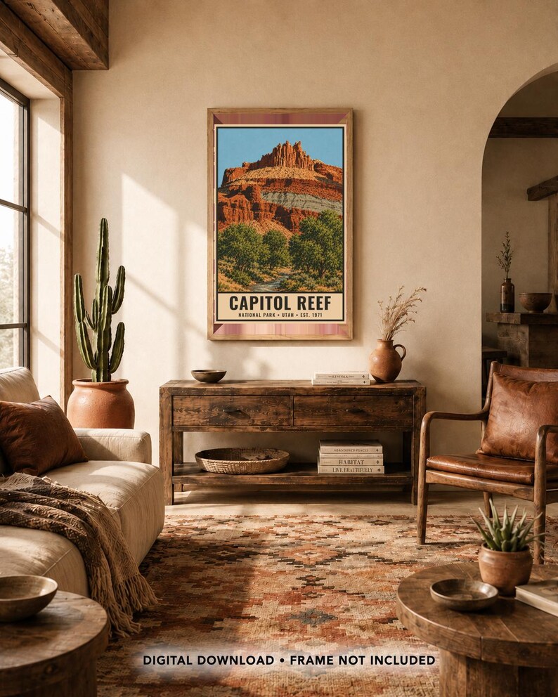 May include: A vertical rectangular wall art print featuring a landscape illustration of Capitol Reef National Park in Utah. The artwork displays red rock formations, green trees, and a blue sky, with the text CAPITOL REEF NATIONAL PARK UTAH EST. 1971.