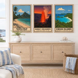 May include: Three framed vertical posters depicting National Park of American Samoa, Hawai'i Volcanoes, and Virgin Islands. Each print features a colorful landscape illustration with text identifying the park name, location, and establishment year.