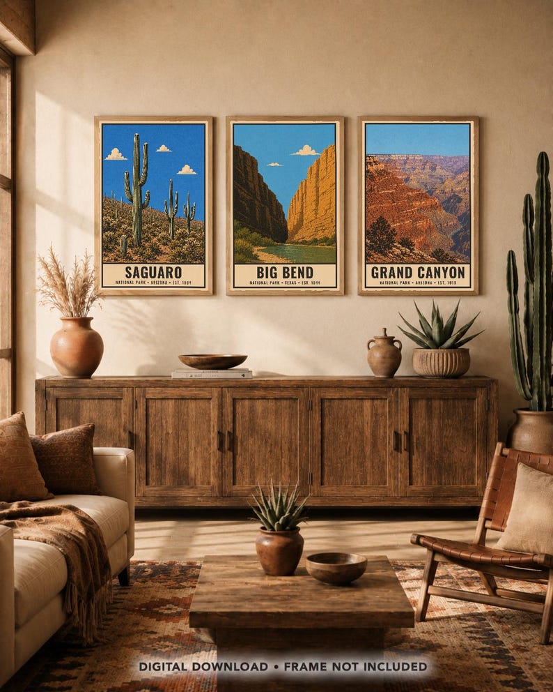 May include: Three framed vertical wall art prints depicting Saguaro, Big Bend, and Grand Canyon National Parks. Each print features a landscape illustration with a blue sky, white clouds, and the park name printed in black text at the bottom.