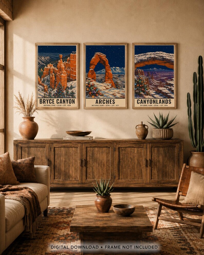 May include: Three vertical wall art prints featuring winter landscapes of Bryce Canyon, Arches, and Canyonlands National Parks. Each print displays snow-covered rock formations, starry night skies, and decorated Christmas trees with text.