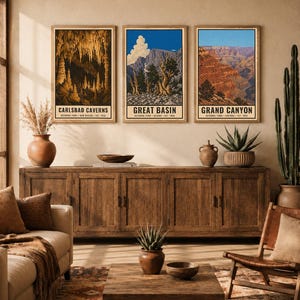 May include: Three rectangular wall art prints featuring illustrations of Carlsbad Caverns, Great Basin, and Grand Canyon National Parks. Each print includes the park name, location, and establishment year in black text at the bottom of the image.