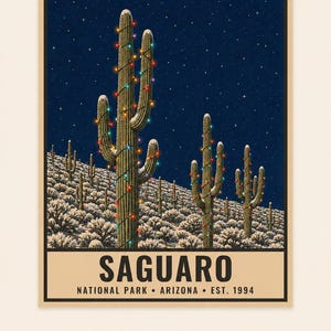 May include: A poster featuring a night scene of saguaro cacti in a snowy desert landscape, decorated with colorful string lights under a starry sky. The text reads SAGUARO NATIONAL PARK ARIZONA EST. 1994. DIGITAL DOWNLOAD FRAME NOT INCLUDED.