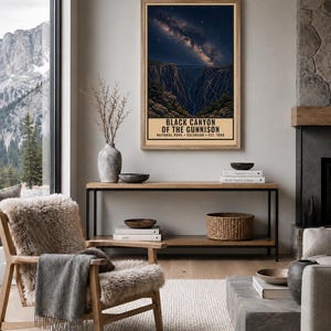 May include: A vertical rectangular wall art print featuring a night sky filled with stars above the dark, deep cliffs of Black Canyon of the Gunnison National Park, Colorado, with the text "BLACK CANYON OF THE GUNNISON NATIONAL PARK COLORADO EST. 1999".