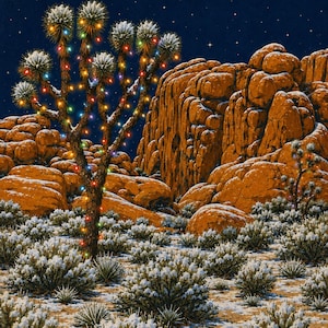 May include: A desert landscape at night featuring a Joshua tree decorated with multicolored string lights. The ground and low-lying desert shrubs are covered in a light dusting of snow, set against large orange rock formations and a dark starry sky.