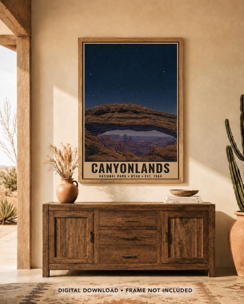 May include: A vertical wall art print featuring a night sky over Mesa Arch in Canyonlands National Park, Utah. The text reads CANYONLANDS NATIONAL PARK UTAH EST. 1964. The image displays a natural stone arch framing a canyon landscape under stars.
