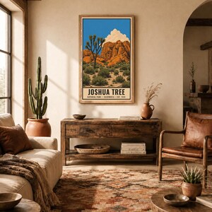 May include: A rectangular wall art print featuring a desert landscape with a Joshua tree, orange rock formations, and a white cloud against a blue sky. The text JOSHUA TREE NATIONAL PARK CALIFORNIA EST. 1994 is printed at the bottom of the poster.