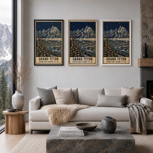 May include: Three vertical wall art prints featuring a night landscape of Grand Teton National Park, Wyoming. Each print displays snow-capped mountains, a winding river, and pine trees under a starry sky, with the text GRAND TETON NATIONAL PARK.