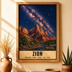 May include: A framed vertical wall art print featuring a night landscape of Zion National Park with red rock mountains, a river, and a starry sky with the Milky Way. The text reads ZION NATIONAL PARK &bull; UTAH &bull; EST. 1919 in black capital letters.