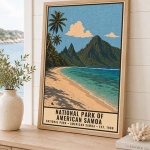 May include: A framed vertical poster featuring a tropical beach scene with palm trees, turquoise water, and green mountains under a blue sky with clouds. The text reads NATIONAL PARK OF AMERICAN SAMOA, NATIONAL PARK AMERICAN SAMOA EST. 1988.