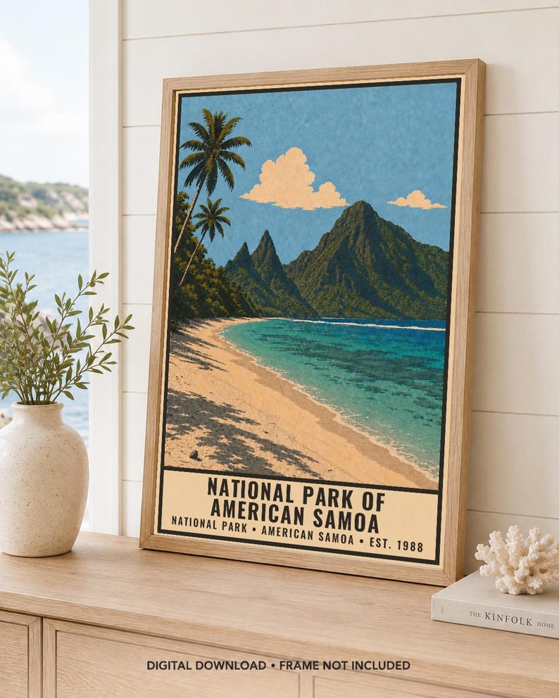 May include: A framed vertical poster featuring a tropical beach scene with palm trees, turquoise water, and green mountains under a blue sky with clouds. The text reads NATIONAL PARK OF AMERICAN SAMOA, NATIONAL PARK AMERICAN SAMOA EST. 1988.