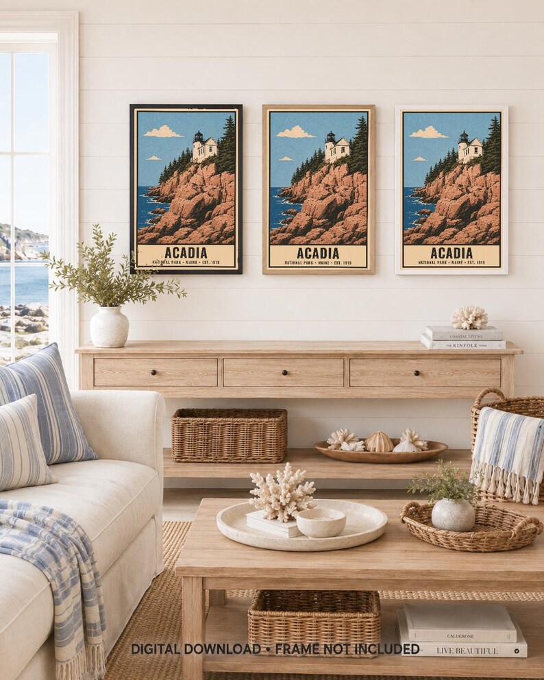 May include: Three framed wall art prints depicting a lighthouse on a rocky cliffside in Acadia National Park, Maine. Each print features a blue sky, evergreen trees, and the text ACADIA NATIONAL PARK MAINE EST. 1919. The frames are black, wood, and white.