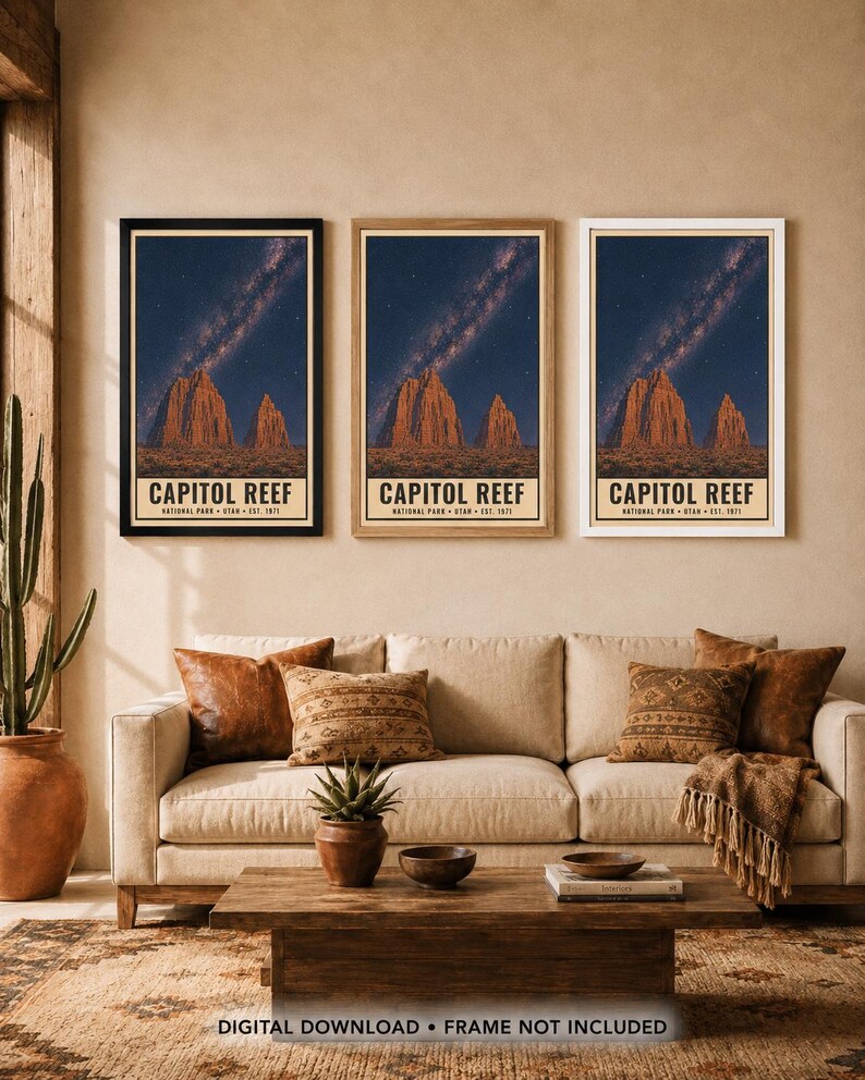 May include: Three identical vertical posters of Capitol Reef National Park, Utah, established 1971. Each print features a night sky with a visible Milky Way galaxy above red rock formations. The posters are displayed in black, wood, and white frames.
