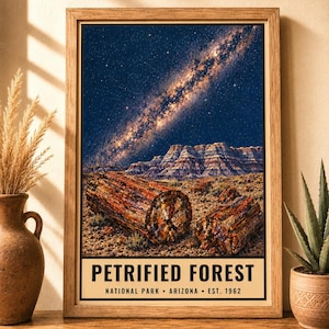 May include: A framed vertical poster featuring a night sky with a visible Milky Way galaxy over a landscape of petrified wood logs and layered rock formations. The text at the bottom reads PETRIFIED FOREST NATIONAL PARK ARIZONA EST. 1962.