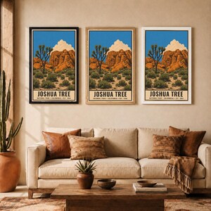 May include: Three vertical wall art prints featuring a Joshua Tree National Park landscape with orange rock formations, green desert vegetation, and a blue sky. Each print displays the text JOSHUA TREE NATIONAL PARK CALIFORNIA EST. 1994.