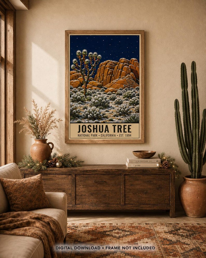 May include: A framed wall art print featuring a night landscape of Joshua Tree National Park with a starry sky, rock formations, and desert vegetation. The text at the bottom reads JOSHUA TREE NATIONAL PARK CALIFORNIA EST. 1994.