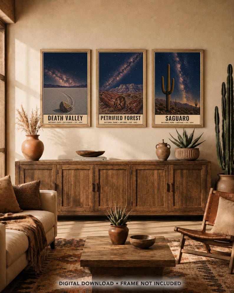 May include: Three rectangular wall art prints in wooden frames featuring night sky landscapes of Death Valley, Petrified Forest, and Saguaro National Parks. Each print displays a starry galaxy above desert terrain and includes text labels.