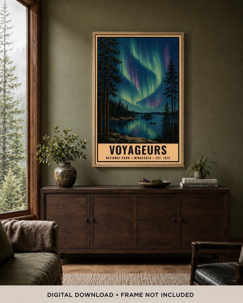 May include: A vertical wall art print featuring a nighttime landscape of Voyageurs National Park in Minnesota. The illustration depicts a lake reflecting vibrant green and purple aurora borealis lights above dark pine trees and a small island.