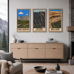 May include: Three vertical wall art prints featuring illustrations of Rocky Mountain, Black Canyon of the Gunnison, and Mesa Verde National Parks. Each print includes the park name, location, and establishment year in black text on a cream background.
