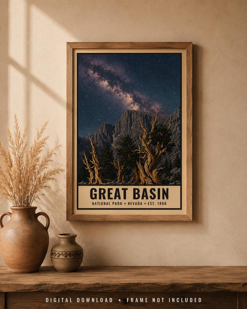 May include: A framed vertical poster featuring a night sky with the Milky Way galaxy above rugged mountain peaks and twisted bristlecone pine trees. The text at the bottom reads GREAT BASIN NATIONAL PARK NEVADA EST. 1986 in bold black lettering.
