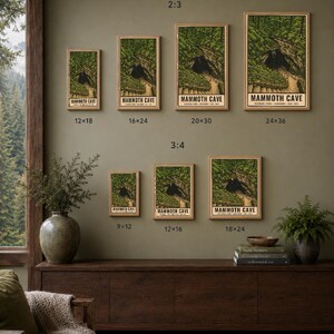 May include: A collection of seven framed posters depicting the Mammoth Cave National Park entrance, displayed in various sizes including 12x18, 16x24, 20x30, 24x36, 9x12, 12x16, and 18x24 inches. The posters feature green forest scenery and text.