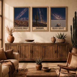 May include: A set of three rectangular wall art prints featuring night sky landscapes of Petrified Forest, Saguaro, and Death Valley National Parks. Each print displays a starry galaxy above desert terrain with text labels at the bottom. Digital download.