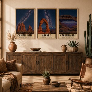 May include: A set of three vertical wall art prints featuring night sky photography of Capitol Reef, Arches, and Canyonlands National Parks. Each print displays a dark blue starry sky above red rock formations with text labels at the bottom.