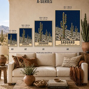 May include: Four posters titled A-SERIES showing a Saguaro National Park illustration with a cactus decorated with lights against a night sky. Sizes range from 11.7 x 16.5 inches to 33.1 x 46.8 inches. The text reads SAGUARO NATIONAL PARK ARIZONA EST. 1994.