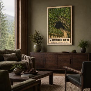 May include: A rectangular wall poster featuring a stylized illustration of the Mammoth Cave National Park entrance, with a stone staircase leading into a dark cave opening surrounded by green trees and the text MAMMOTH CAVE NATIONAL PARK KENTUCKY EST. 1941.
