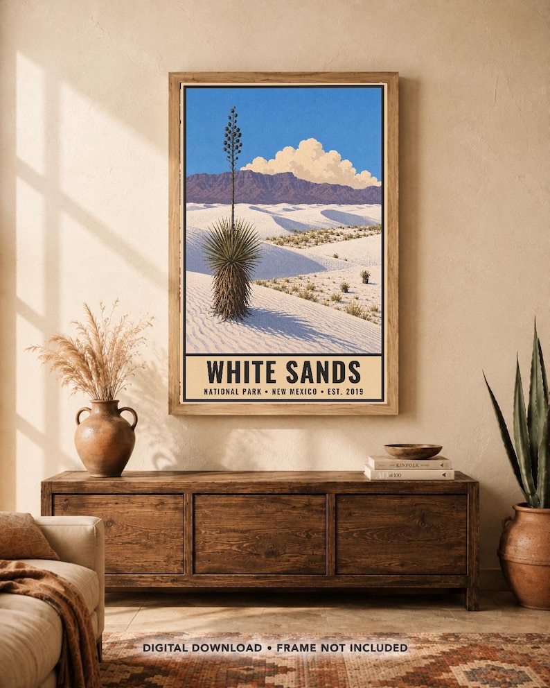May include: A framed vertical poster depicting the White Sands National Park in New Mexico. The illustration features white sand dunes, a tall yucca plant, purple mountains, and a blue sky with clouds. The text reads WHITE SANDS NATIONAL PARK NEW MEXICO EST. 2019.