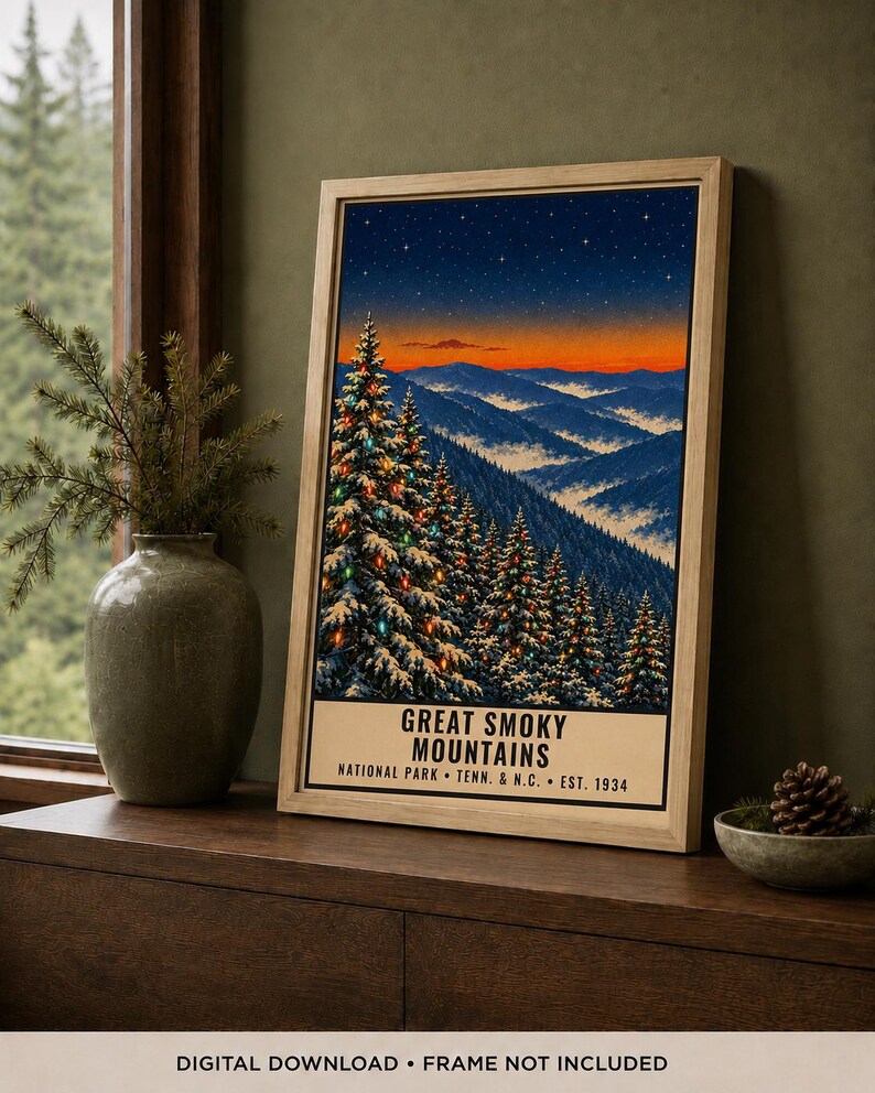 May include: A framed vertical poster featuring a snowy mountain landscape at twilight with evergreen trees decorated with colorful lights. The text reads GREAT SMOKY MOUNTAINS NATIONAL PARK TENN. & N.C. EST. 1934. The bottom text states DIGITAL DOWNLOAD.
