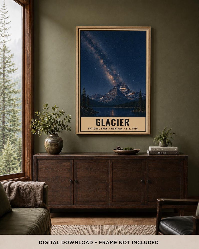 May include: A vertical wall art print featuring a night landscape of Glacier National Park in Montana. The image displays a snow-capped mountain peak under a starry sky with the Milky Way, above a dark lake. Text reads: GLACIER NATIONAL PARK MONTANA EST. 1910.