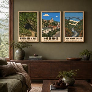 May include: Three vertical art prints in light wood frames featuring illustrations of Mammoth Cave, Hot Springs, and New River Gorge National Parks. Each print includes the park name, location, and establishment year in black text at the bottom.